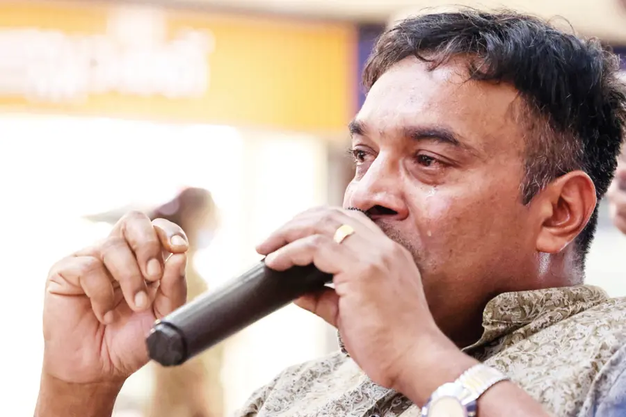Writer Babu Abraham talks at a discussion on his book Kambilikandathe Kalbharanikal