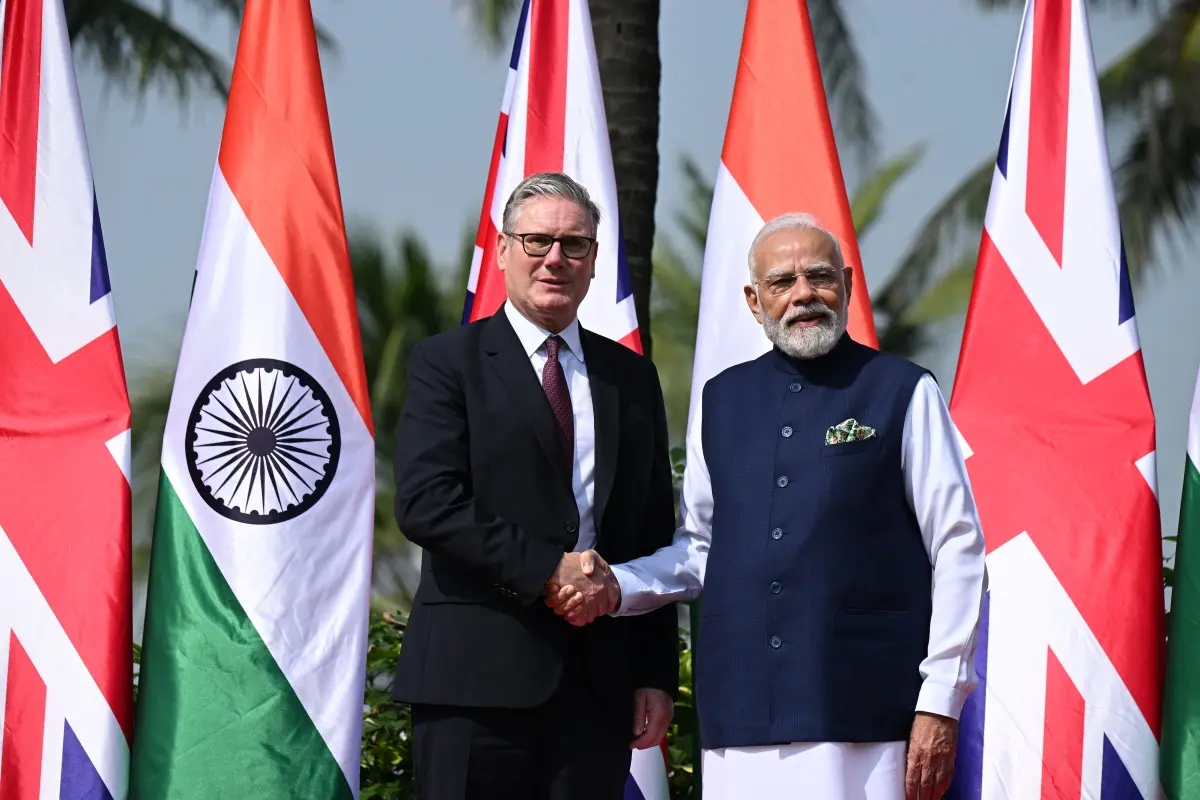 British Prime Minister Keir Starmer, left is greeted by Indian Prime Minister Narendra Modi on his arrival at Raj Bhavan in Mumbai | Photo: AP