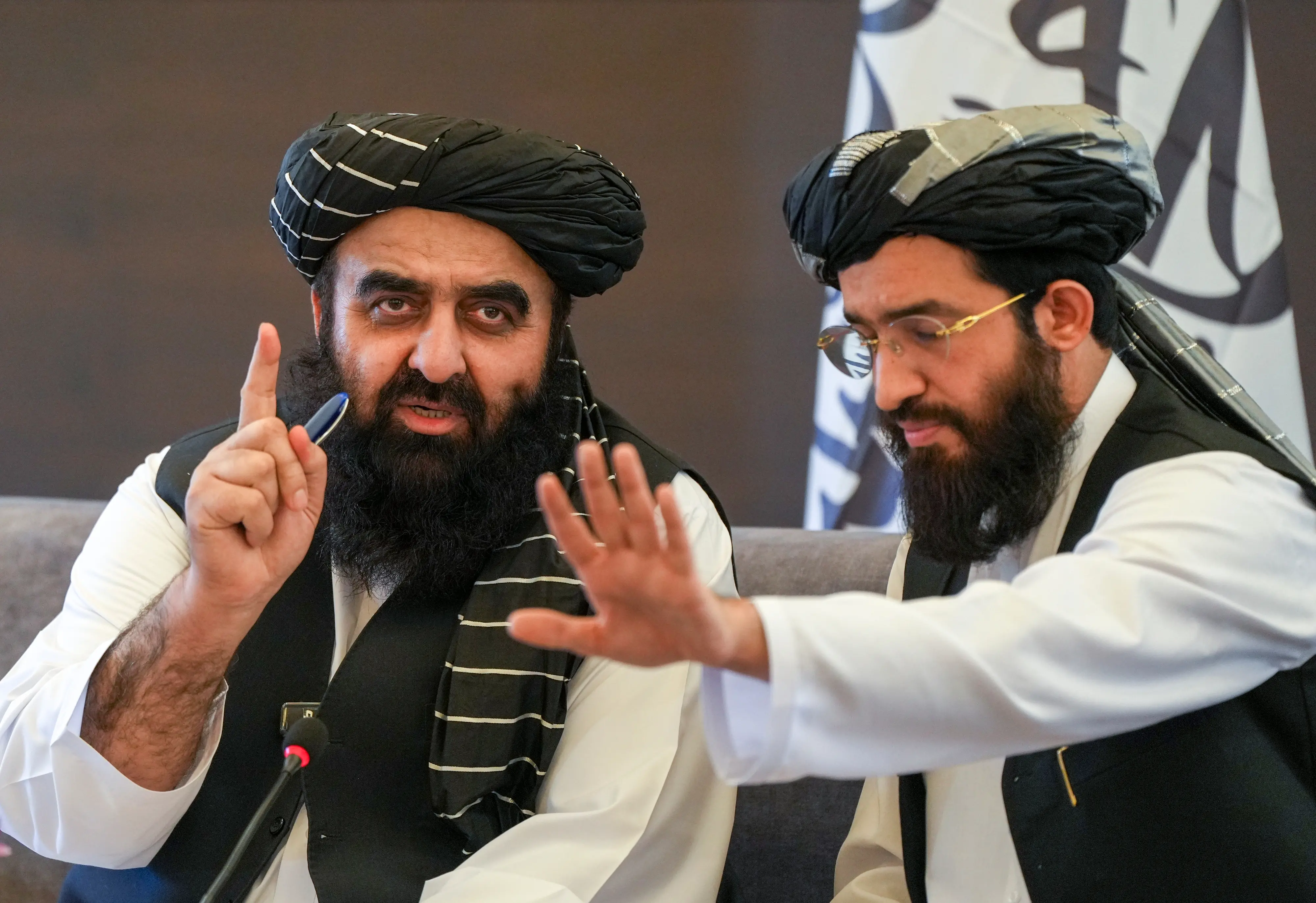 Afghan Foreign Minister Amir Khan Muttaqi, left, speaks during a press conference at the Afghan embassy, in New Delhi. | Photo: PTI