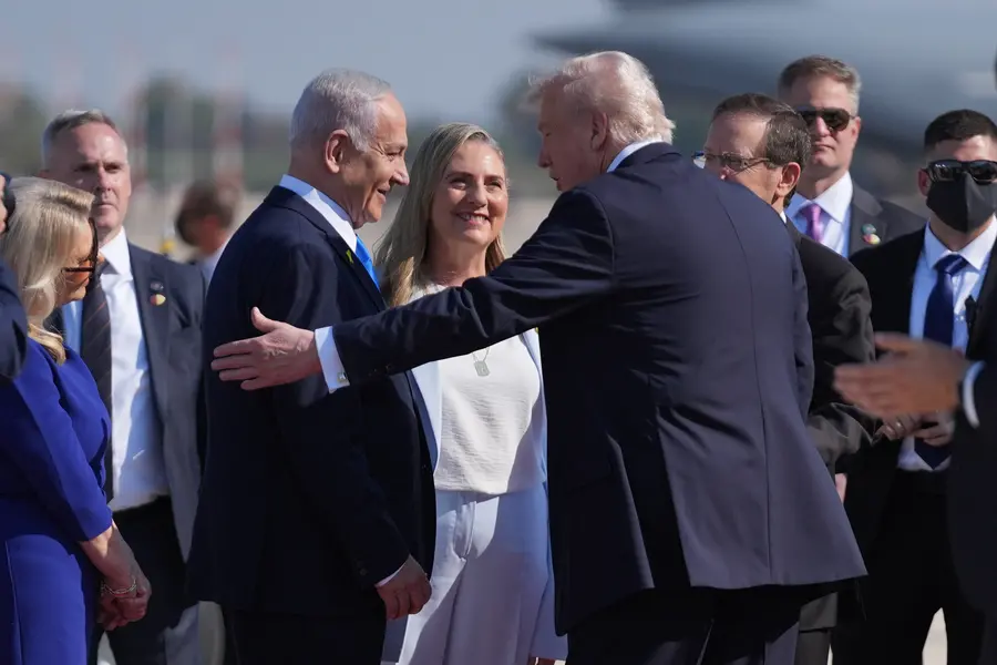 President Donald Trump greets Israel's Prime Minister Benjamin Netanyahu as he arrives at Ben Gurion International Airport