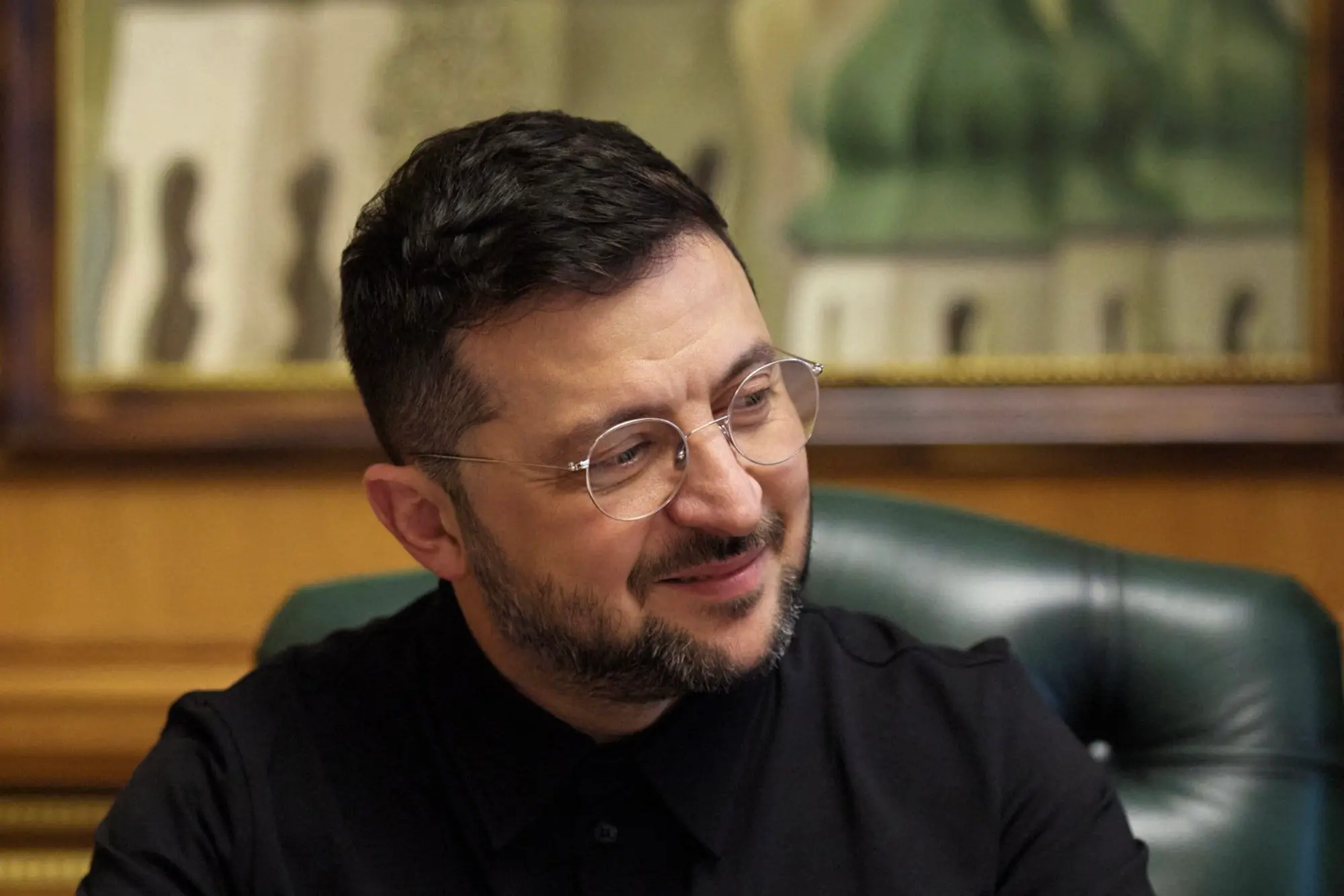 Ukraine's President Volodymyr Zelensky listening during a phone call with the US President while sitting at his office in Kyiv. | File image: AFP