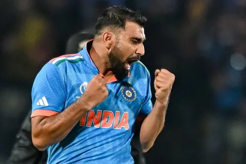 Mohammed Shami celebrates after taking the wicket of New Zealand's Matt Henry during the 2023 ICC Men's Cricket World Cup one-day international (ODI) match between India and New Zealand at the Himachal Pradesh Cricket Association Stadium in Dharamsala on October 22, 2023 | Photo: AFP