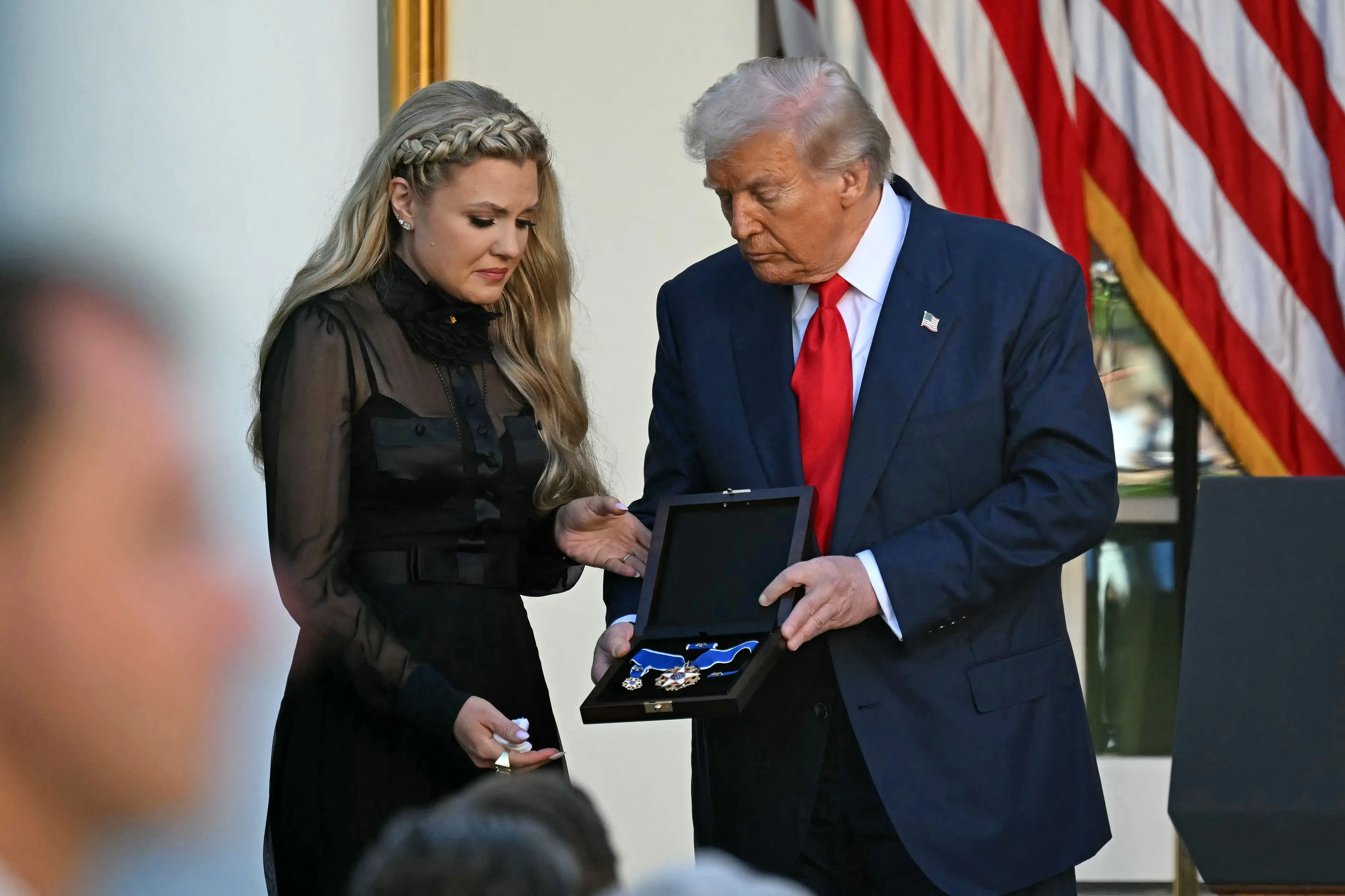US President Donald Trump and Erika Kirk, Charlie Kirk's widow, participate in a Medal of Freedom Ceremony for late US right-wing activist Charlie Kirk in the Rose Garden of the White House | Photo: AFP