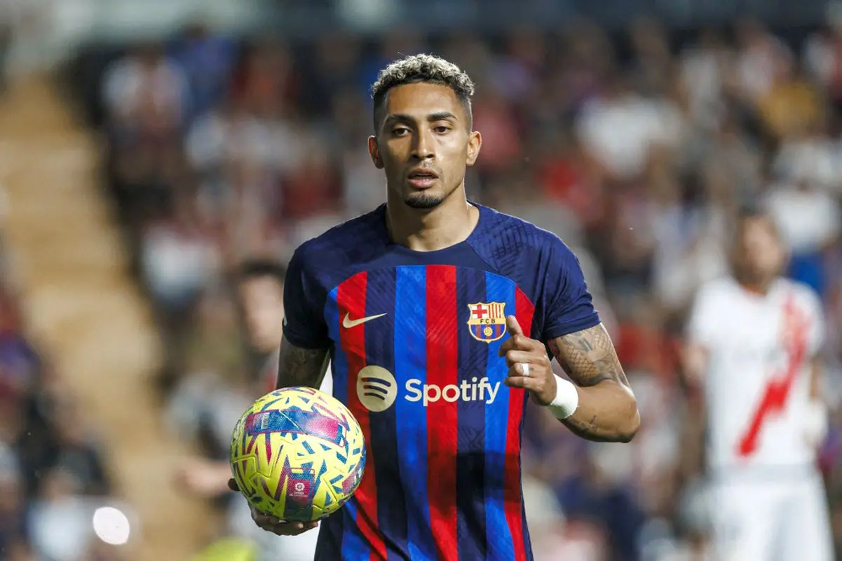 Barcelona's Raphinha walks with the ball during a Spanish La Liga soccer match. AP Photo/Pablo Garcia