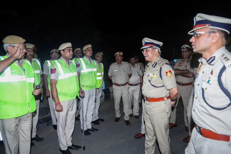 Police Commissioner Satish Golcha interacts with Delhi Police personnel as they conduct a general patrol, in New Delhi