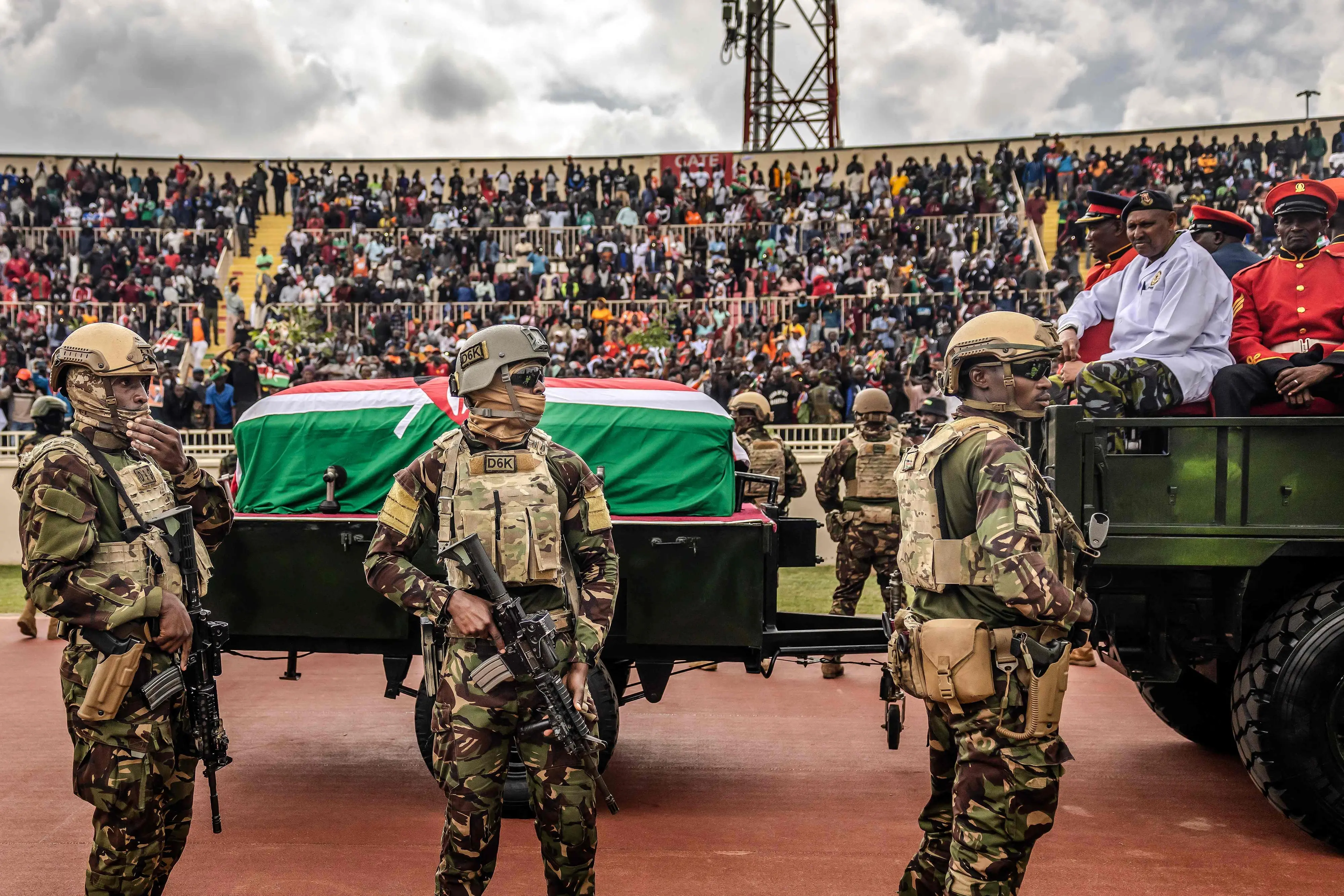 Kenya Defence Forces (KDF) soldiers guard the coffin of Kenya's opposition leader and former Prime Minister Raila Odinga from the crowd during his State Funeral at Nyayo Stadium in Nairobi on October 17, 2025.| Photo: AFP