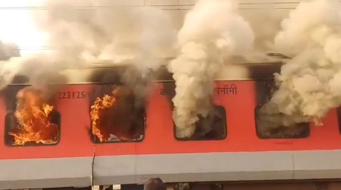 Smoke and flames engulf a coach of the Amritsar-Saharsa Express at Sirhind Station, Punjab