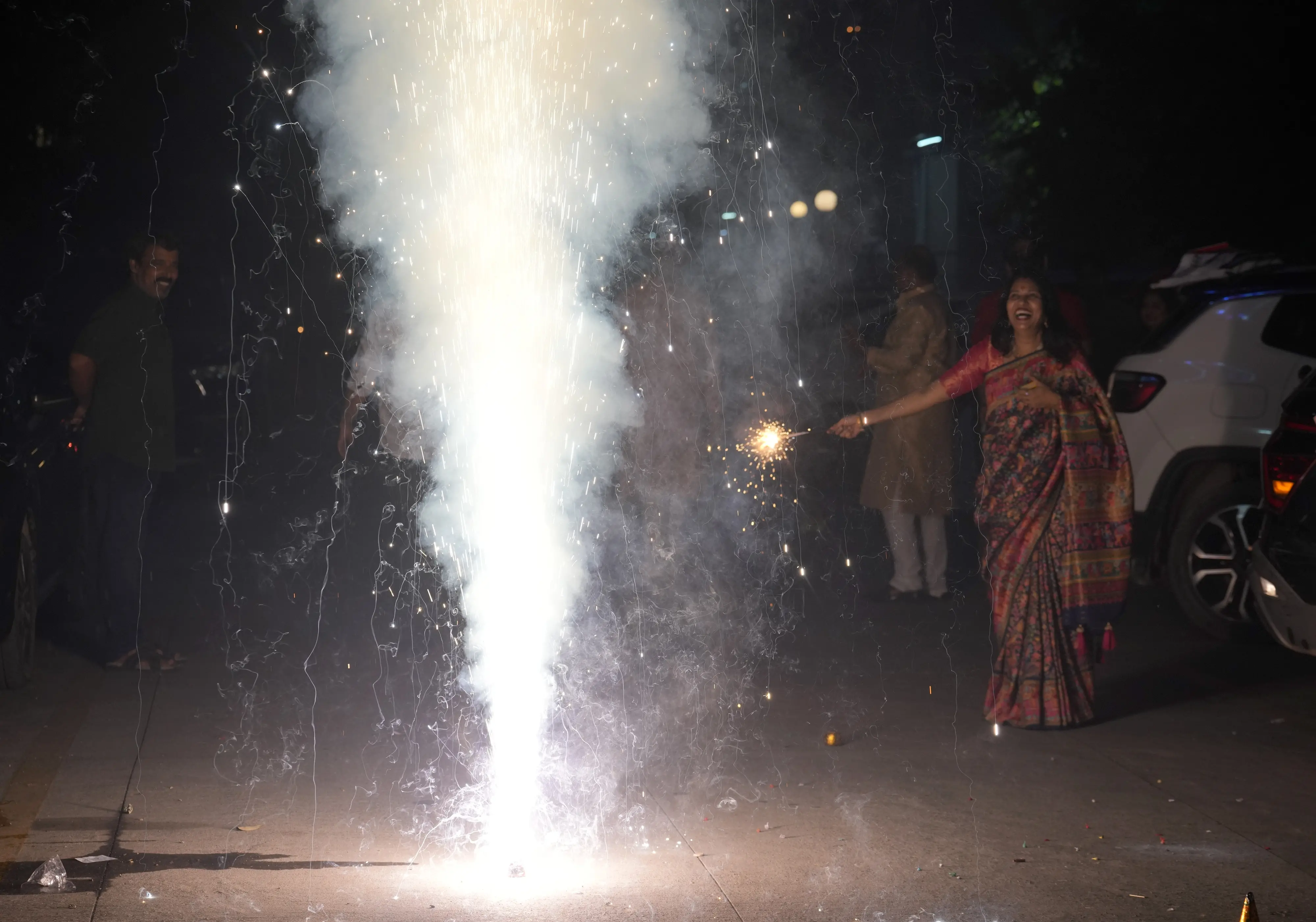 People burst firecrackers on the occasion of the 'Diwali' festival, in New Delhi | Photo: PTI