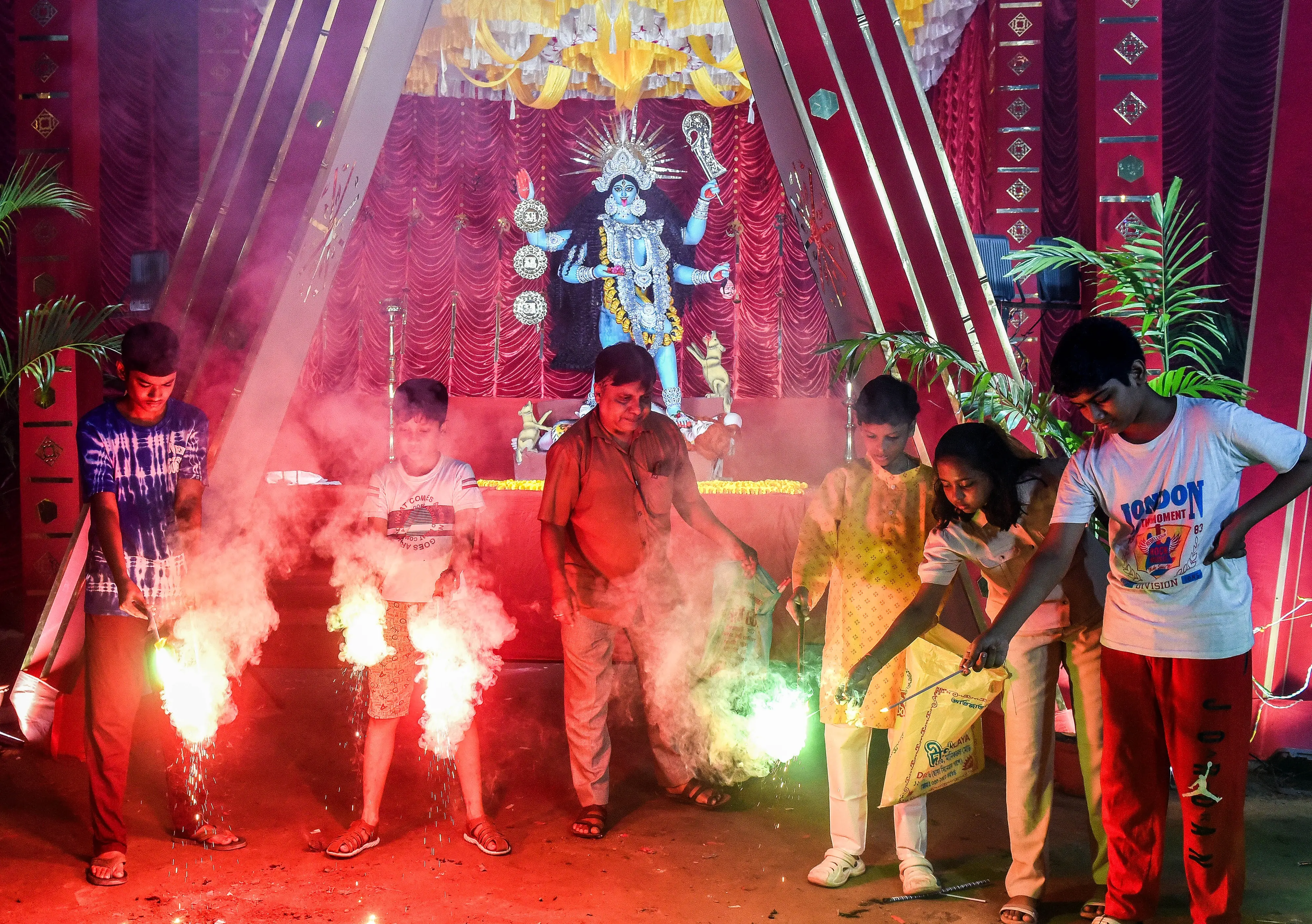 Children burst firecrackers in front of Kali Puja pandal, on the occasion of Kali Puja in Kolkata | Photo: ANI