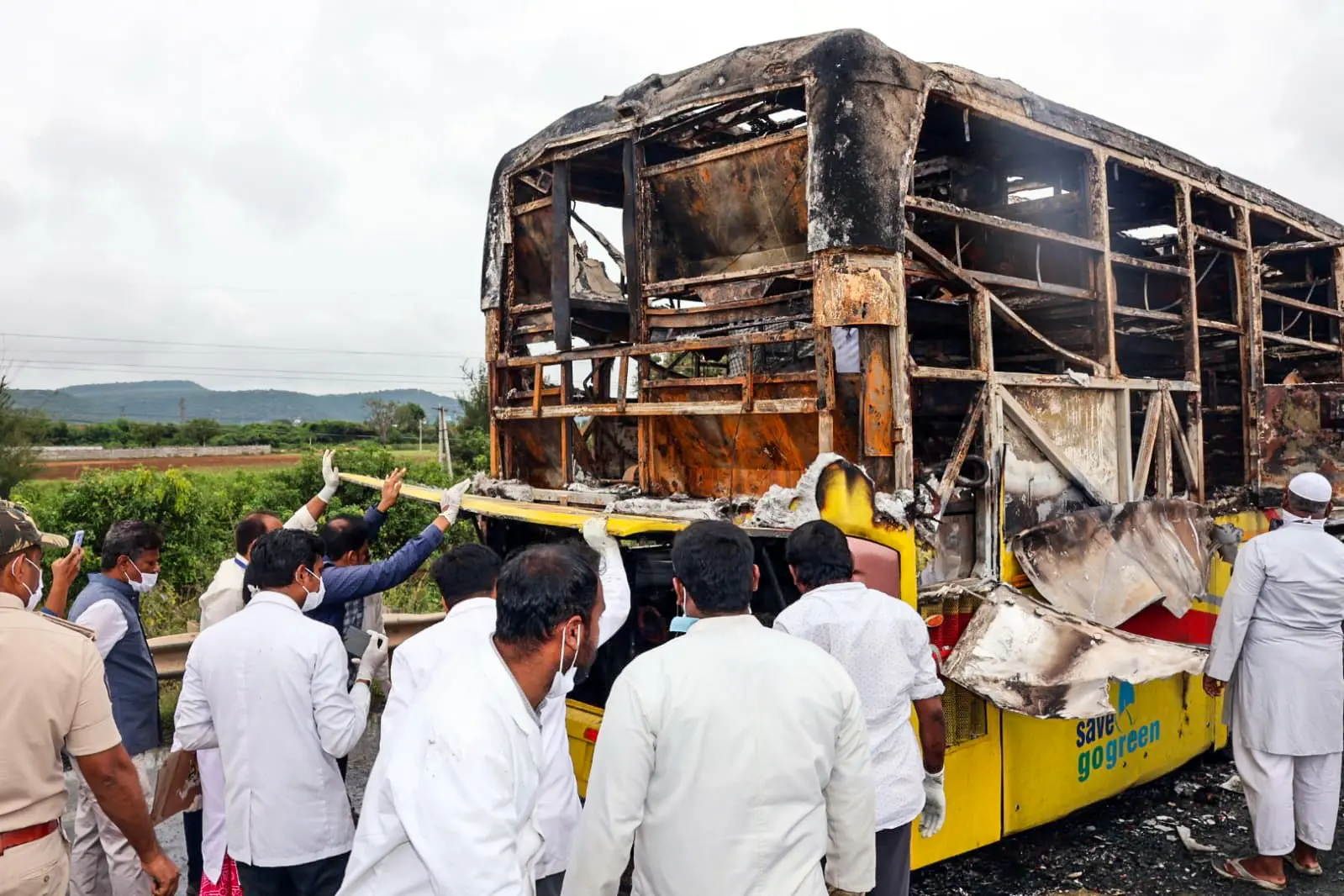 Forensic experts collecting samples from the spot after a bus caught fire following a collision with a two-wheeler near the Chinnatekur village, in Kurnool | Photo: ANI