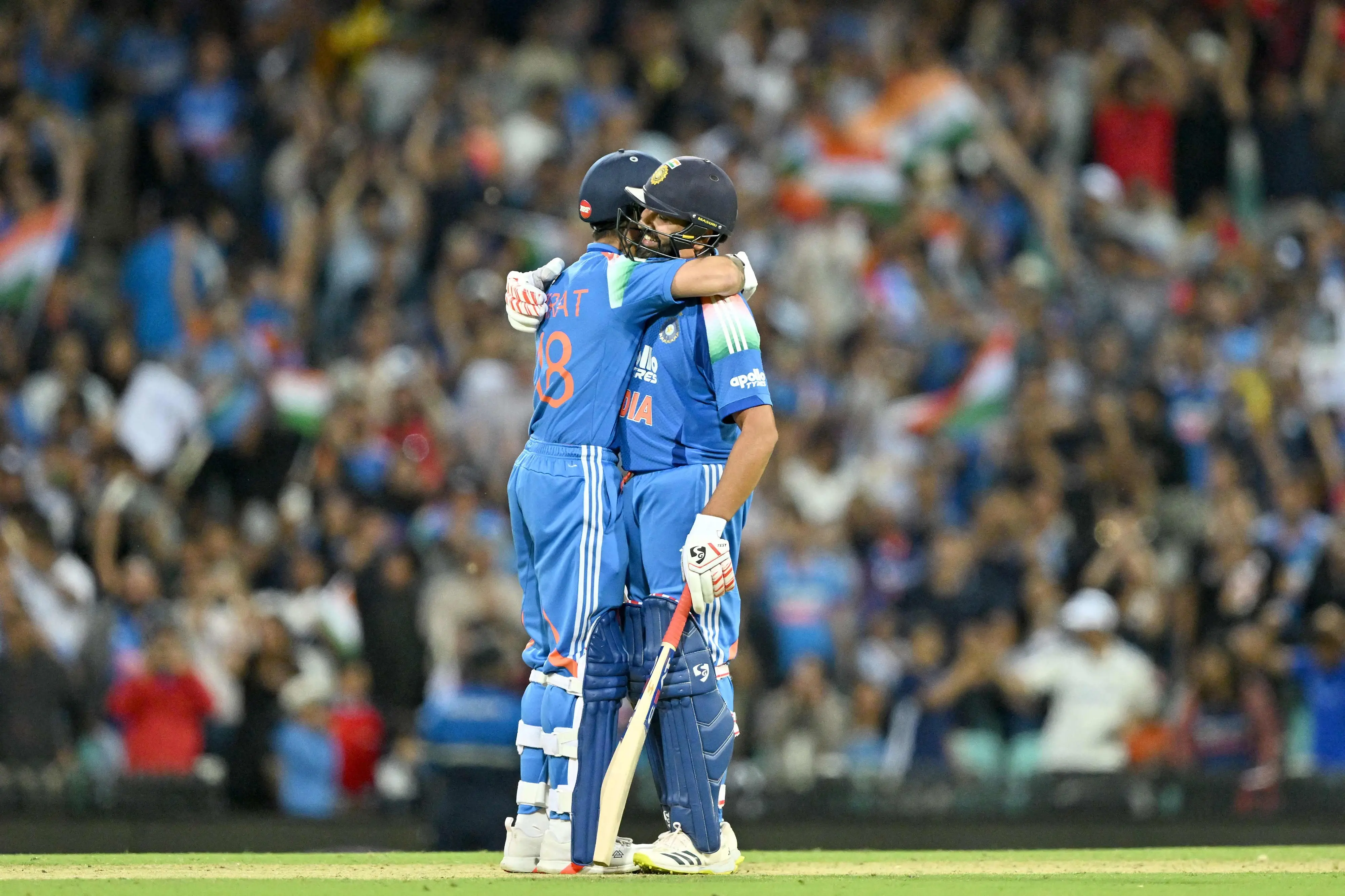 Rohit Sharma (R) and Virat Kohli celebrate their win in the third one-day international (ODI) men's cricket match between Australia and India | AFP