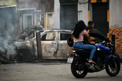 Massive police raid on Rio gang in Brazil leaves at least 64 dead and 81 arrested