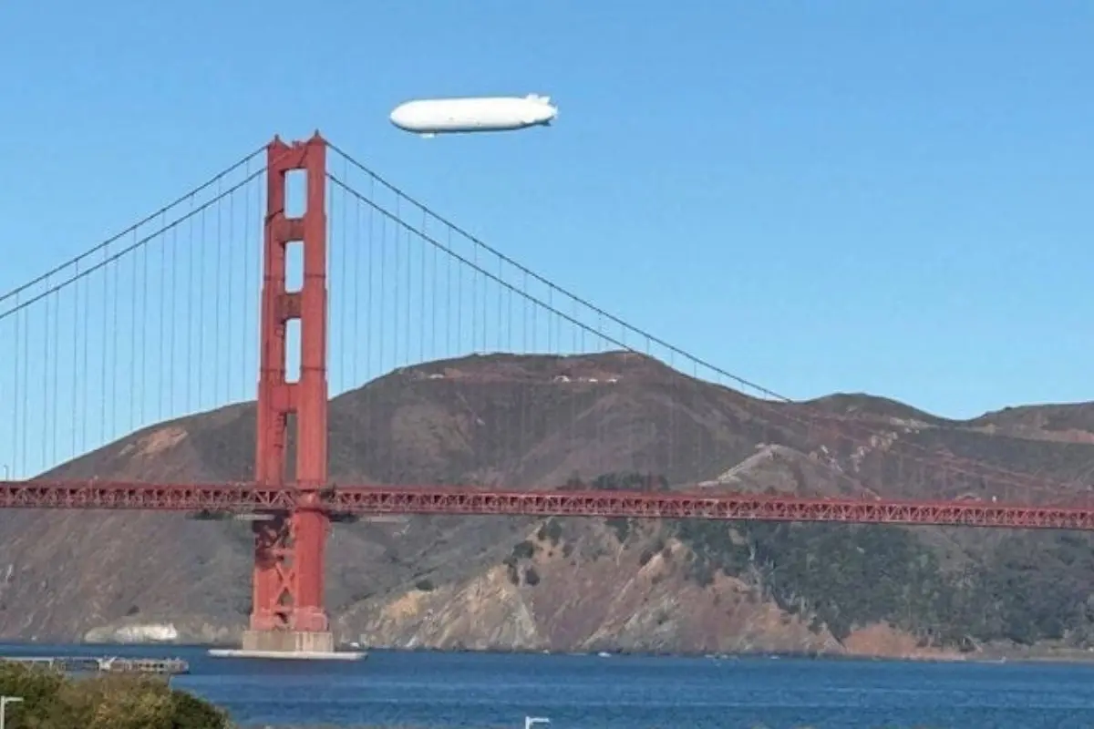 A massive white airship, identified as Pathfinder 1 from Sergey Brin's LTA Research, floats over San Francisco during a test flight on Tuesday, drawing attention from residents across the Bay Area. Photo: X