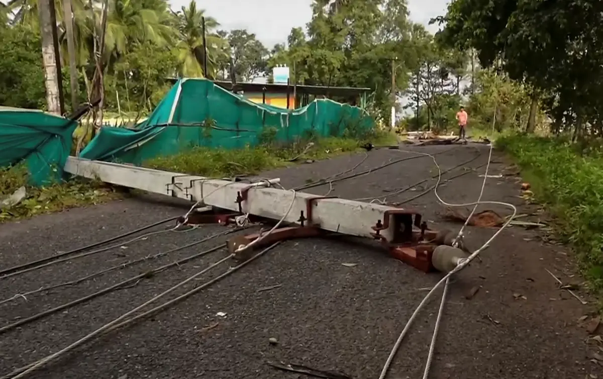 A broken electric pole lies across a road with wires scattered following the destruction caused by Cyclone Montha in Andhra Pradesh | Screengrab: PTI