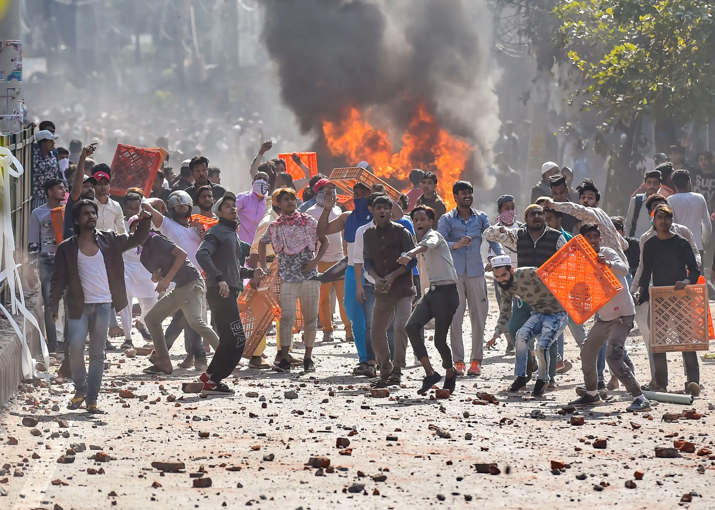 Protestors hurl brick-bats during clashes between a group of anti-CAA protestors and supporters of the new citizenship act, at Jafrabad in north-east Delhi | File photo: PTI