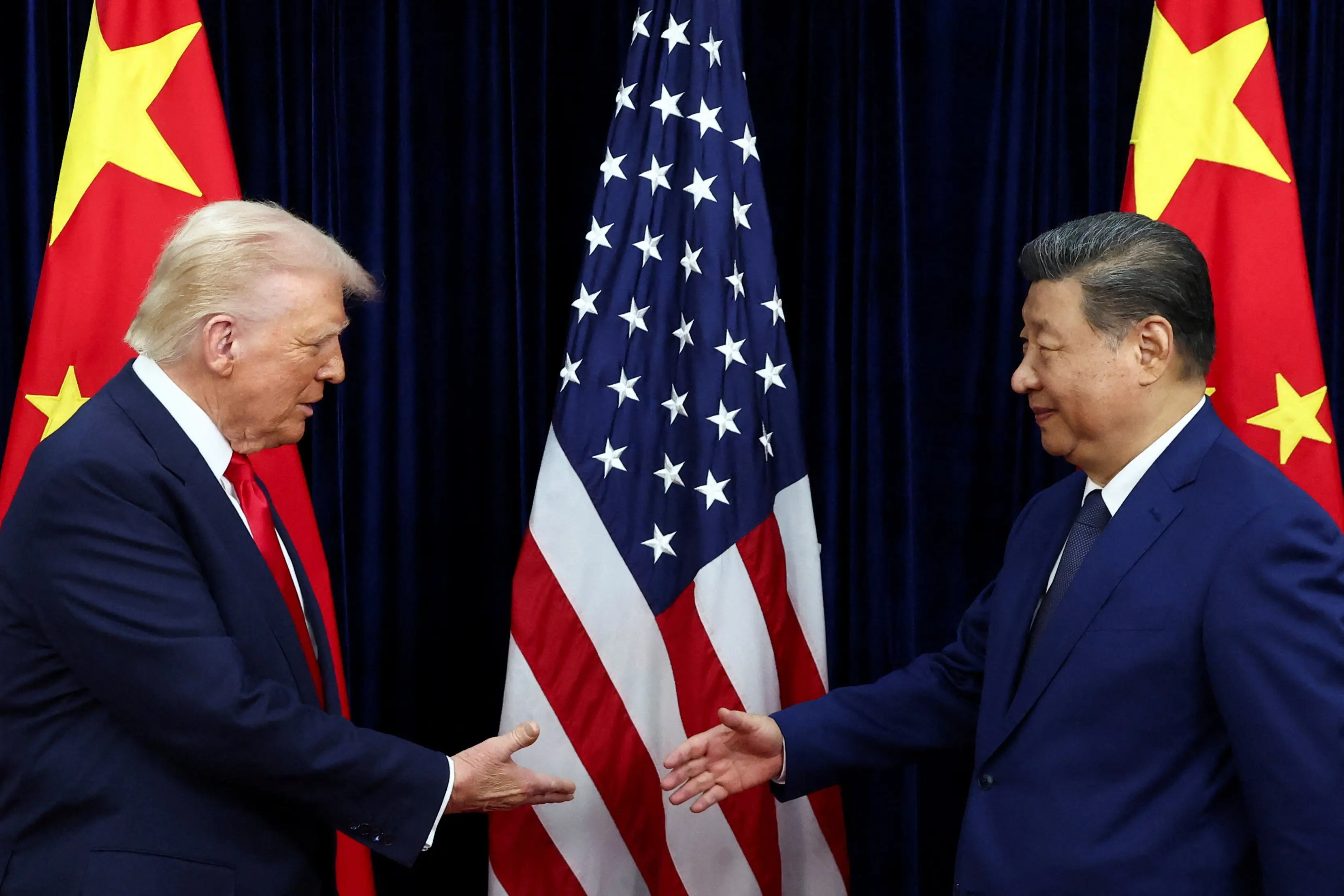US President Donald Trump shakes hands with Chinese President Xi Jinping as they hold a bilateral meeting at Gimhae International Airport, on the sidelines of the Asia-Pacific Economic Cooperation (APEC) summit, in Busan on Thursday.| Photo: ANI