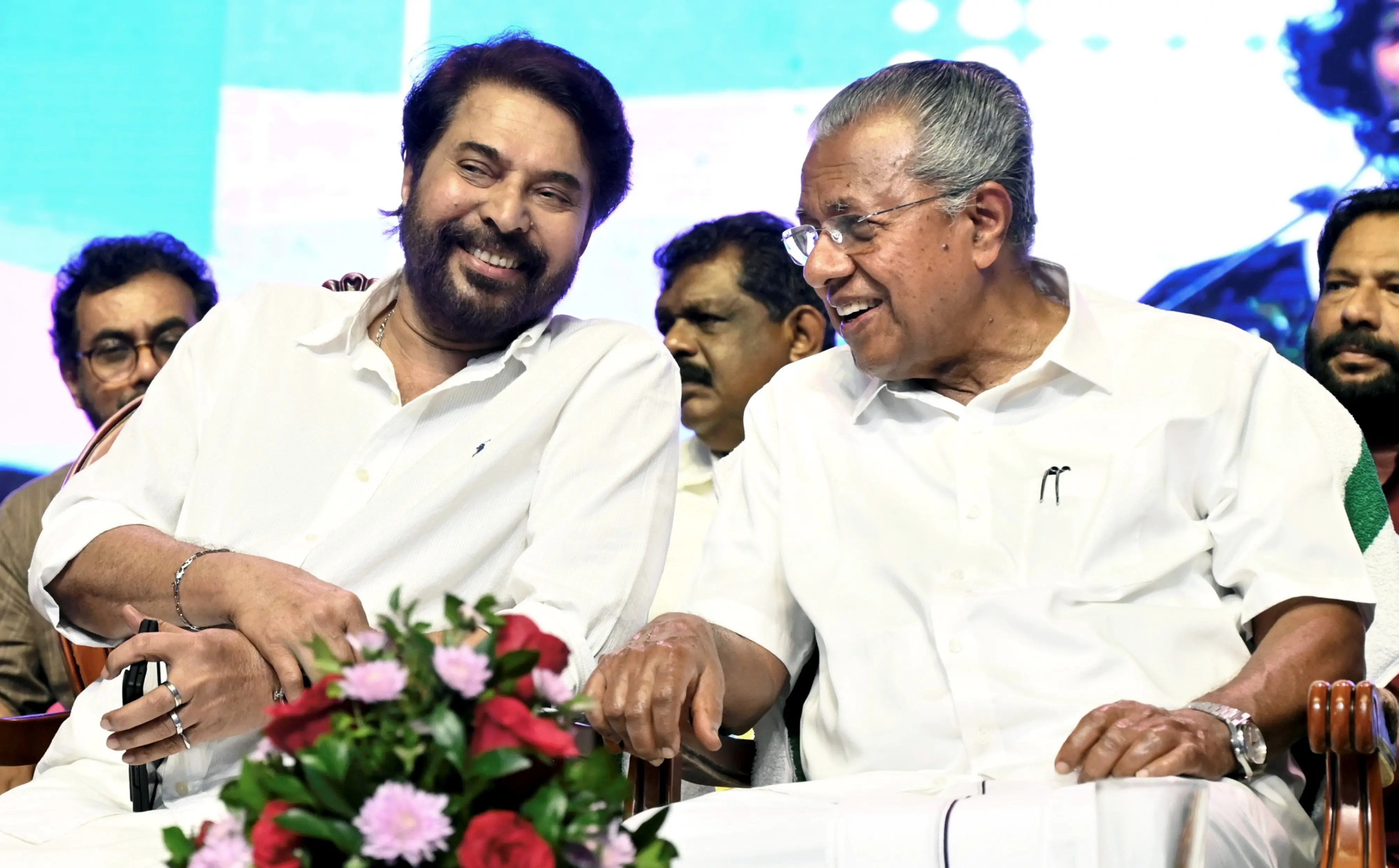 Kerala Chief Minister Pinarayi Vijayan, right, and actor Mammootty during a public event organised by the state government to announce the eradication of extreme poverty from the state | Photo: PTI