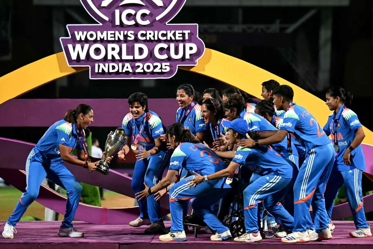 India's players celebrate with the trophy after winning the ICC Women's Cricket World Cup 2025 one-day international (ODI) final match between India and South Africa at the DY Patil Stadium in Navi Mumbai (Photo: AFP)
