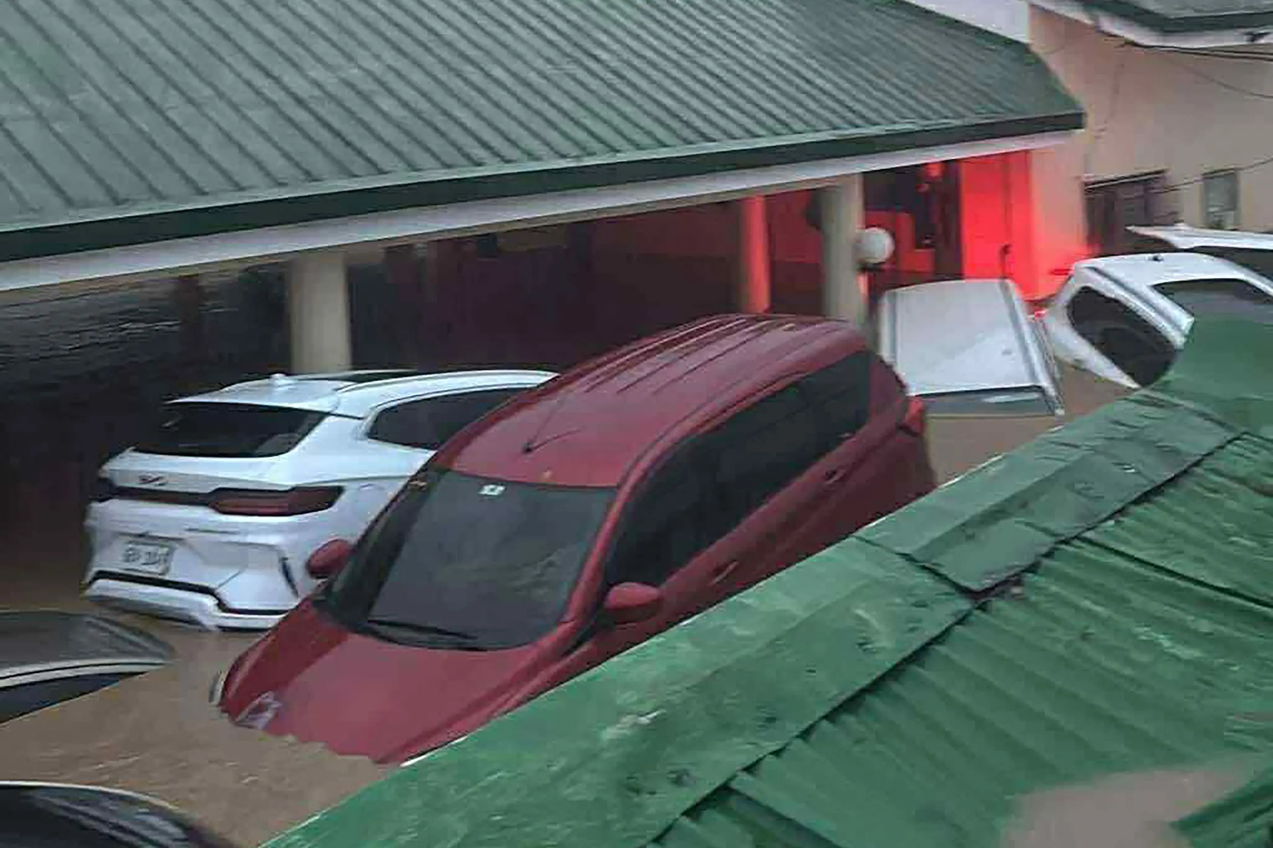 This screen grab taken from video released by Don del Rosario shows cars submerged in floodwaters brought by Typhoon Kalmaegi at a village in Cebu City | Photo: AFP/Don del Rosario