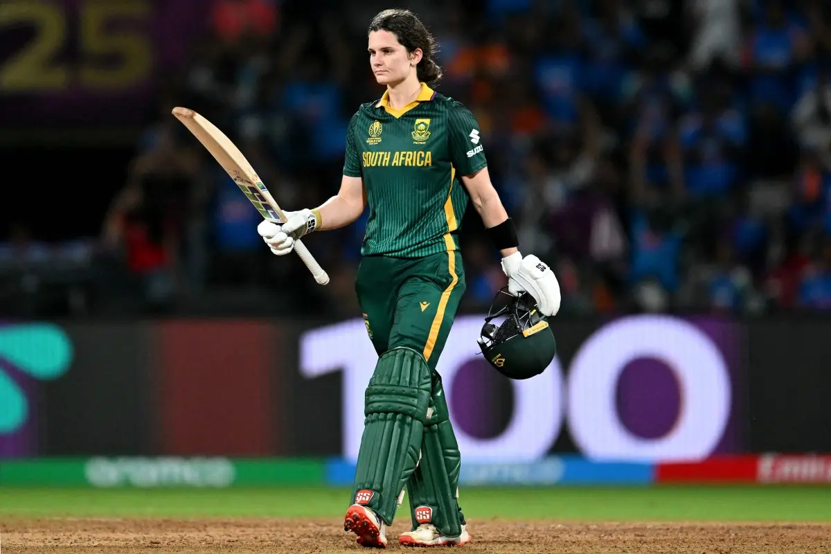 South Africa's captain Laura Wolvaardt celebrates after scoring a century (100 runs) during the ICC Women's Cricket World Cup 2025 one-day international (ODI) final match between India and South Africa at the DY Patil Stadium in Navi Mumbai. | Photo: AFP