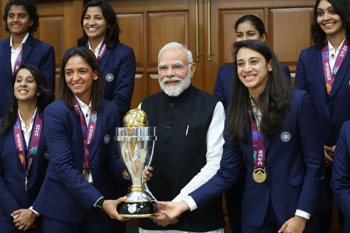 The Indian cricket team, World Cup winners, pose with Prime Minister Narendra Modi. | Photo: X/ANI