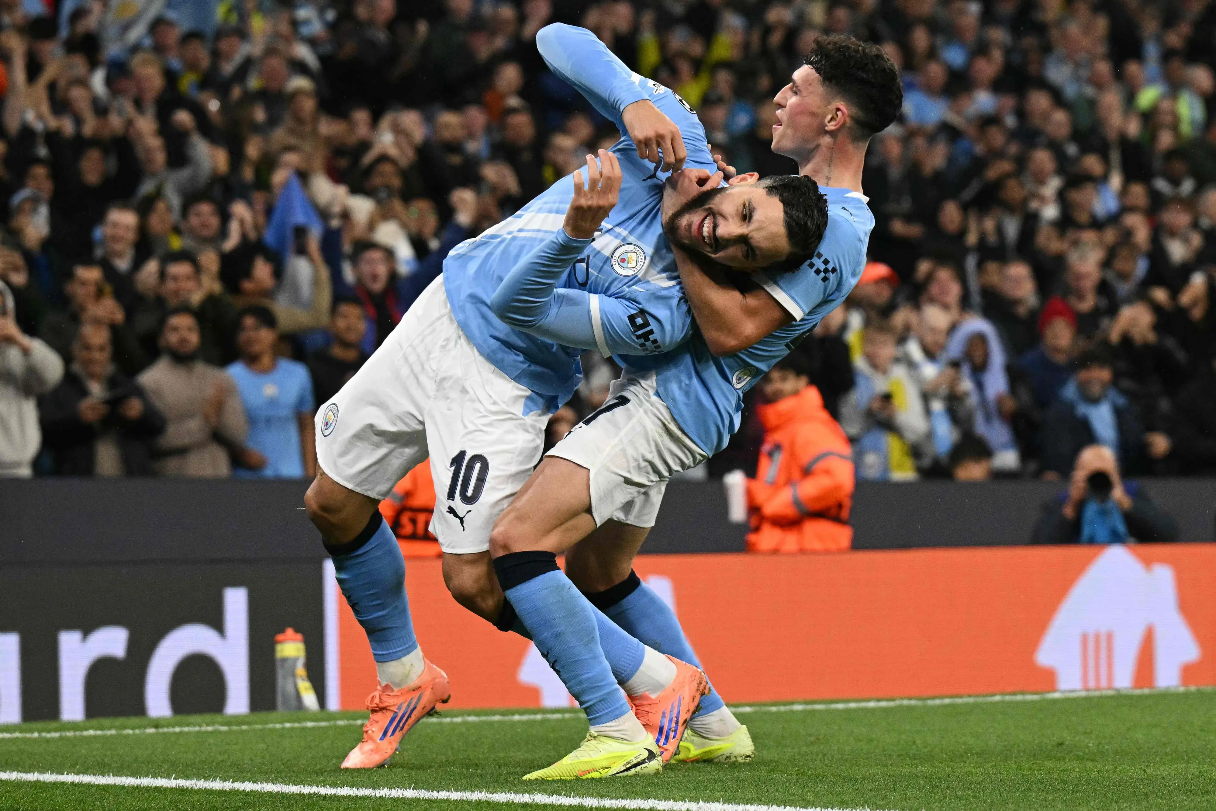 Manchester City's Rayan Cherki celebrates with Phil Foden after scoring his team's fourth goal | AFP