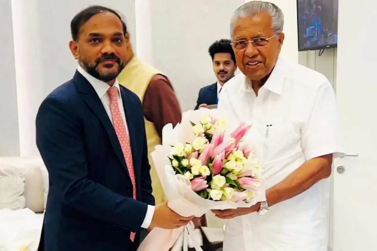 Chief Minister Pinarayi Vijayan being received by charge d'affaires Sanjay K Muluka | Photo: X