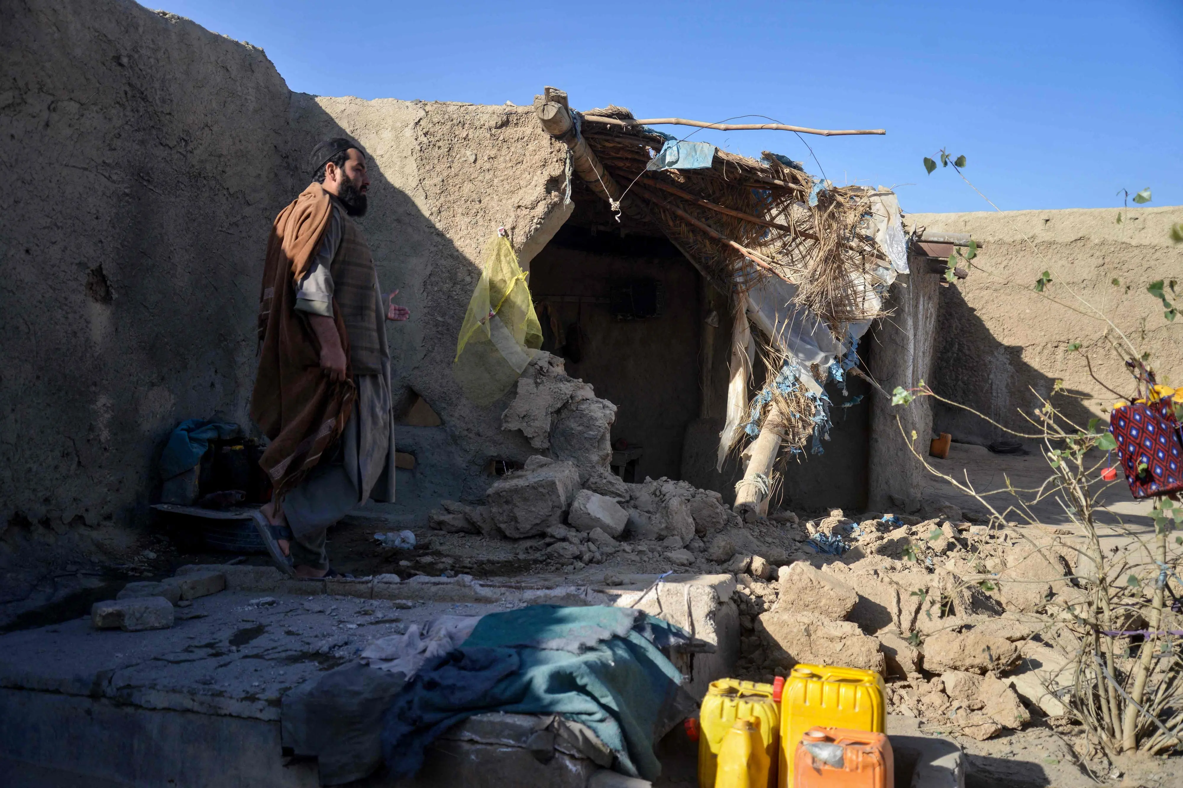 An Afghan man inspects a damaged house, following cross-border fire from Pakistan's artillery shelling, at a village in the Spin Boldak district of Kandahar on November 7 | Photo: AFP