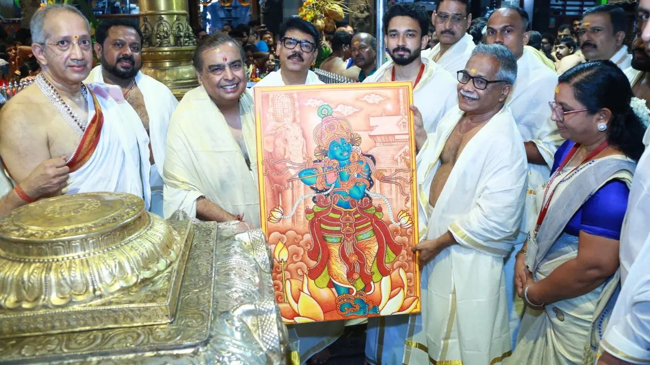 Devaswom Chairman Dr. V. K. Vijayan presents a gift to Mukesh Ambani | Photo: Guruvayur Devaswom Board