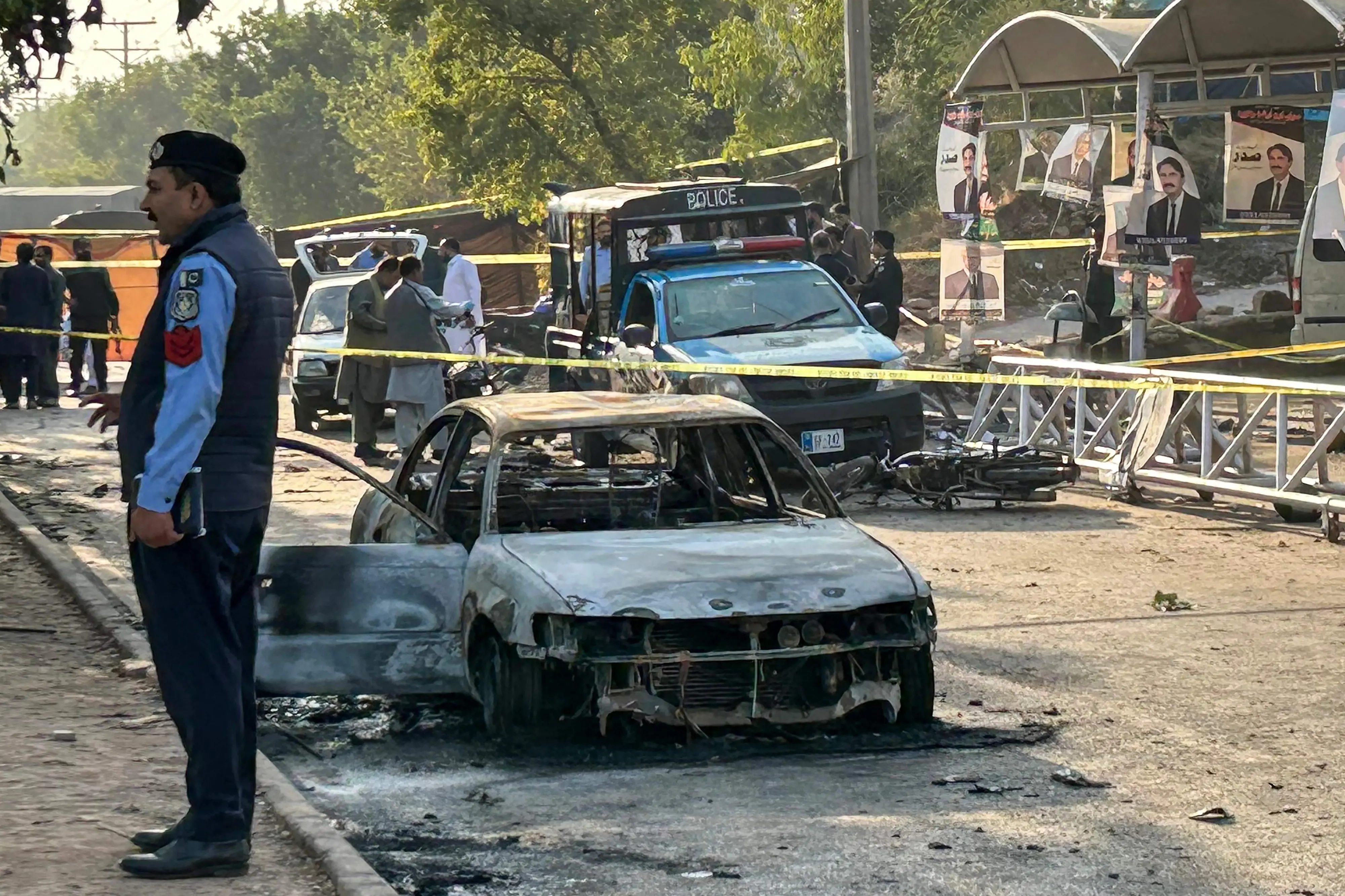 Policemen examine damaged vehicles after a suicide blast outside the district court in Islamabad on November 11, 2025. The Pakistani Taliban claimed a suicide bombing that killed at least 12 people in Islamabad on November 11, a rare attack by the militant group on the country's capital. | Photo: AFP