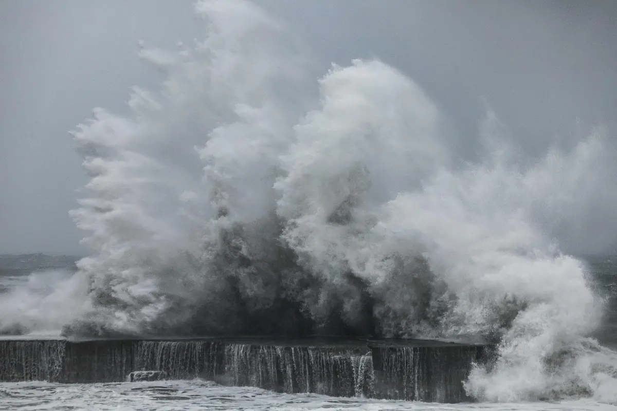 Strong waves crash against the sea wall in Yilan on November 11, 2025, as Typhoon Fung-Wong approaches