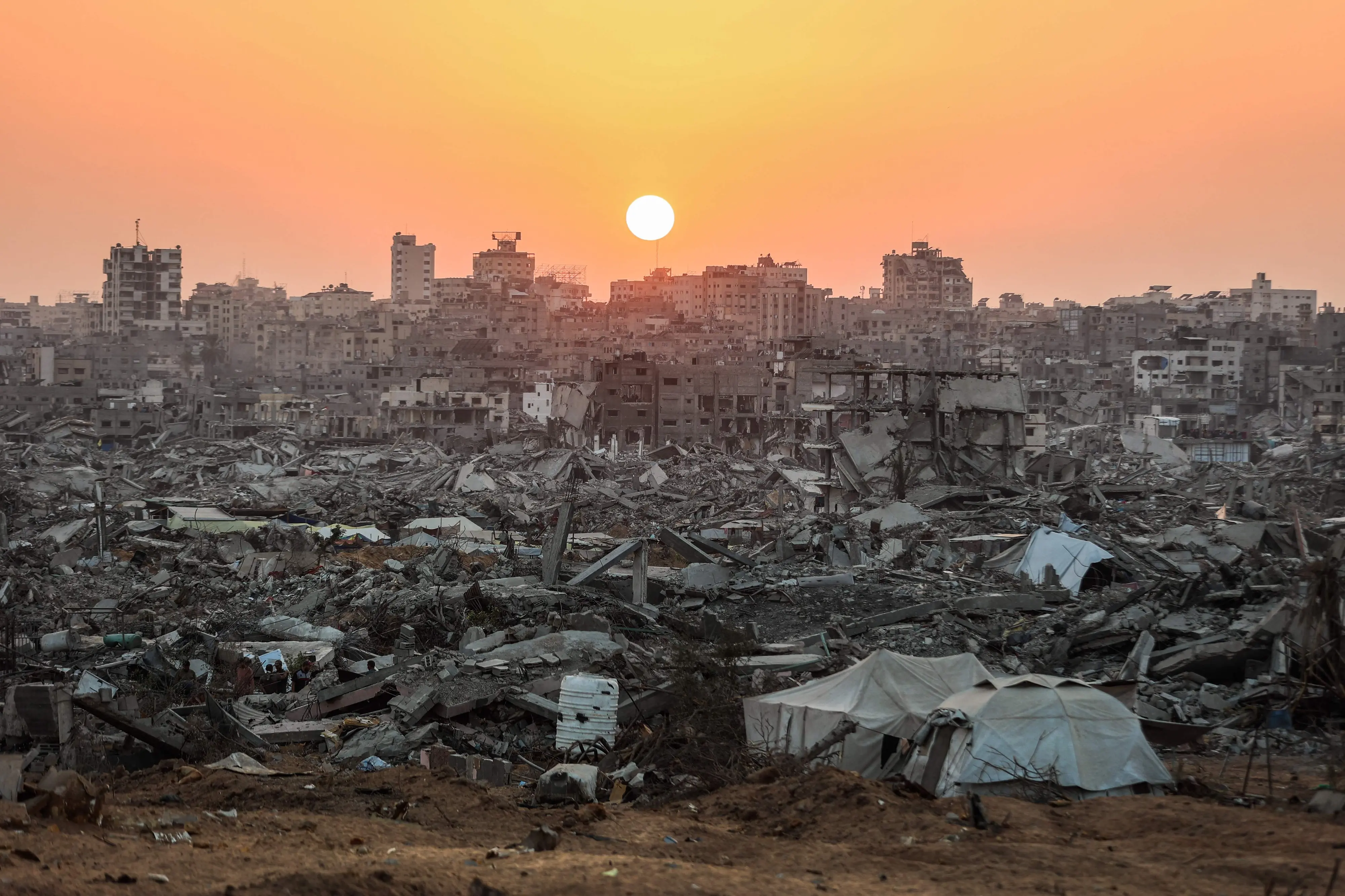 The sun sets over a heavily damaged area of Jabalia, in the northern Gaza Strip | File photo: AFP