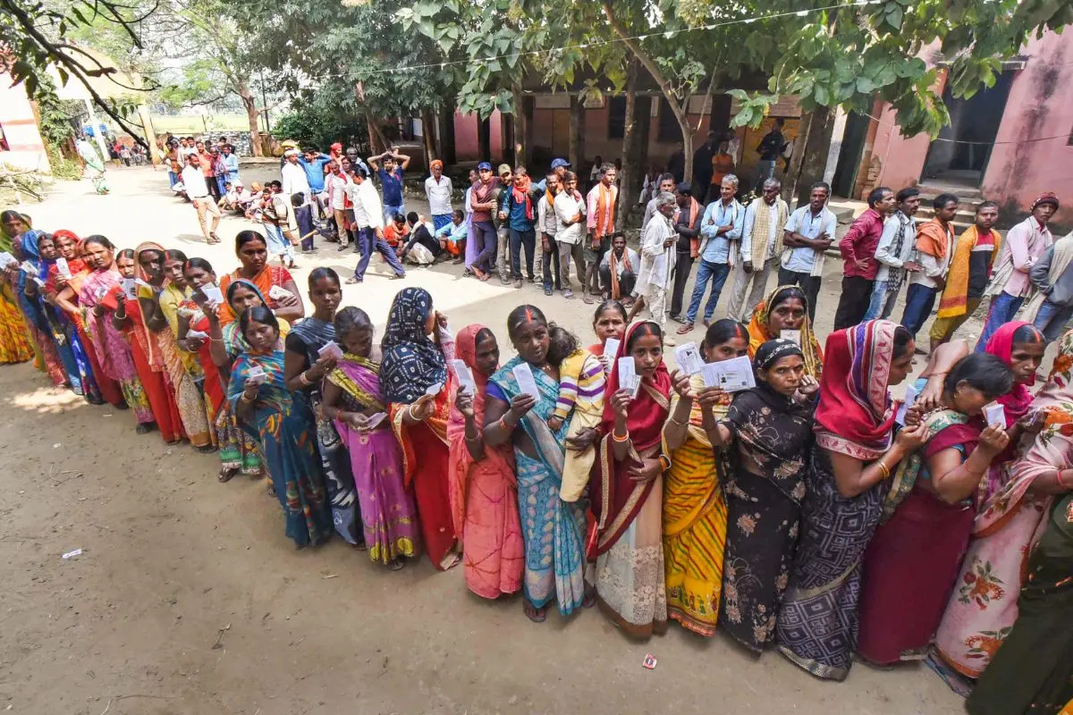 Voters wait in a queue to cast their vote for the second phase of the Bihar assembly election, in Jehanabad on Tuesday. (ANI Photo)