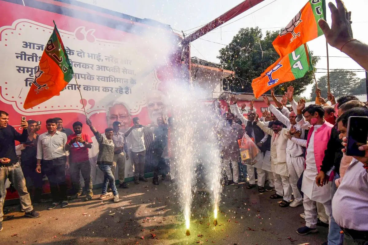 BJP supporters celebrate their alliance's lead in the initial results of the Bihar Assembly polls, in Patna, Friday, Nov. 14, 2025 (Photo: PTI)
