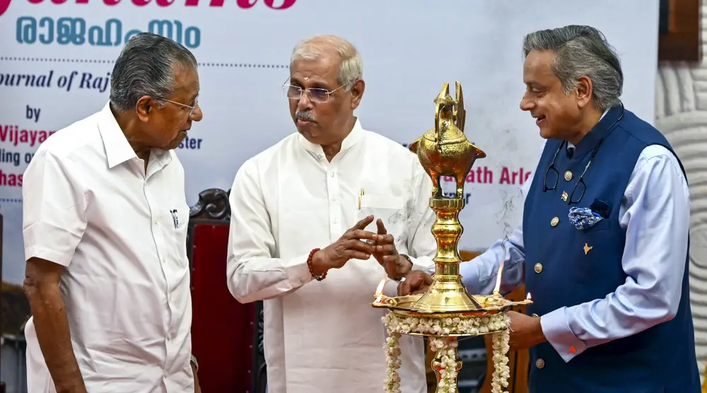 Kerala Governor Rajendra Arlekar, Chief Minister Pinarayi Vijayan and Congress MP Shashi Tharoor during the release of the inaugural edition of 'Rajahams', the official quarterly magazine launched by the Raj Bhavan, in Thiruvananthapuram | PTI