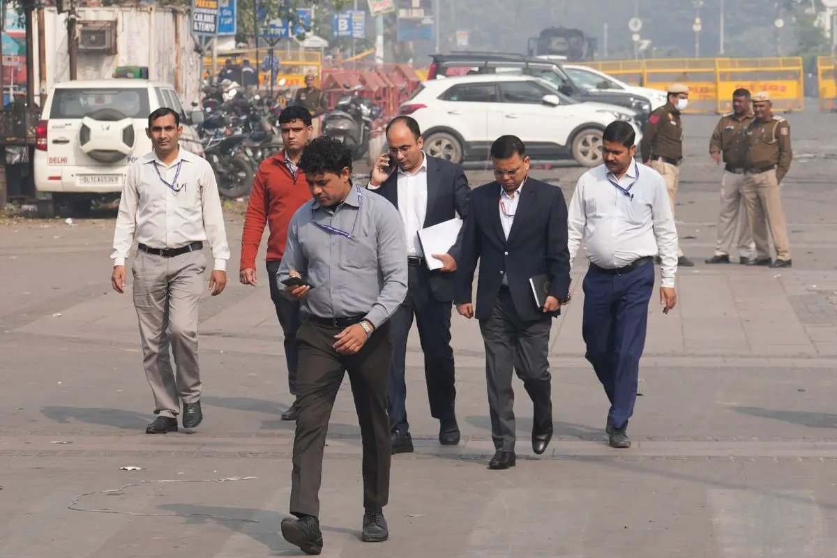 Officials at the site near Red Fort after a blast that claimed the lives of 12 people and injured several in New Delhi, on Wednesday. (PTI Photo/Kamal Kishore)