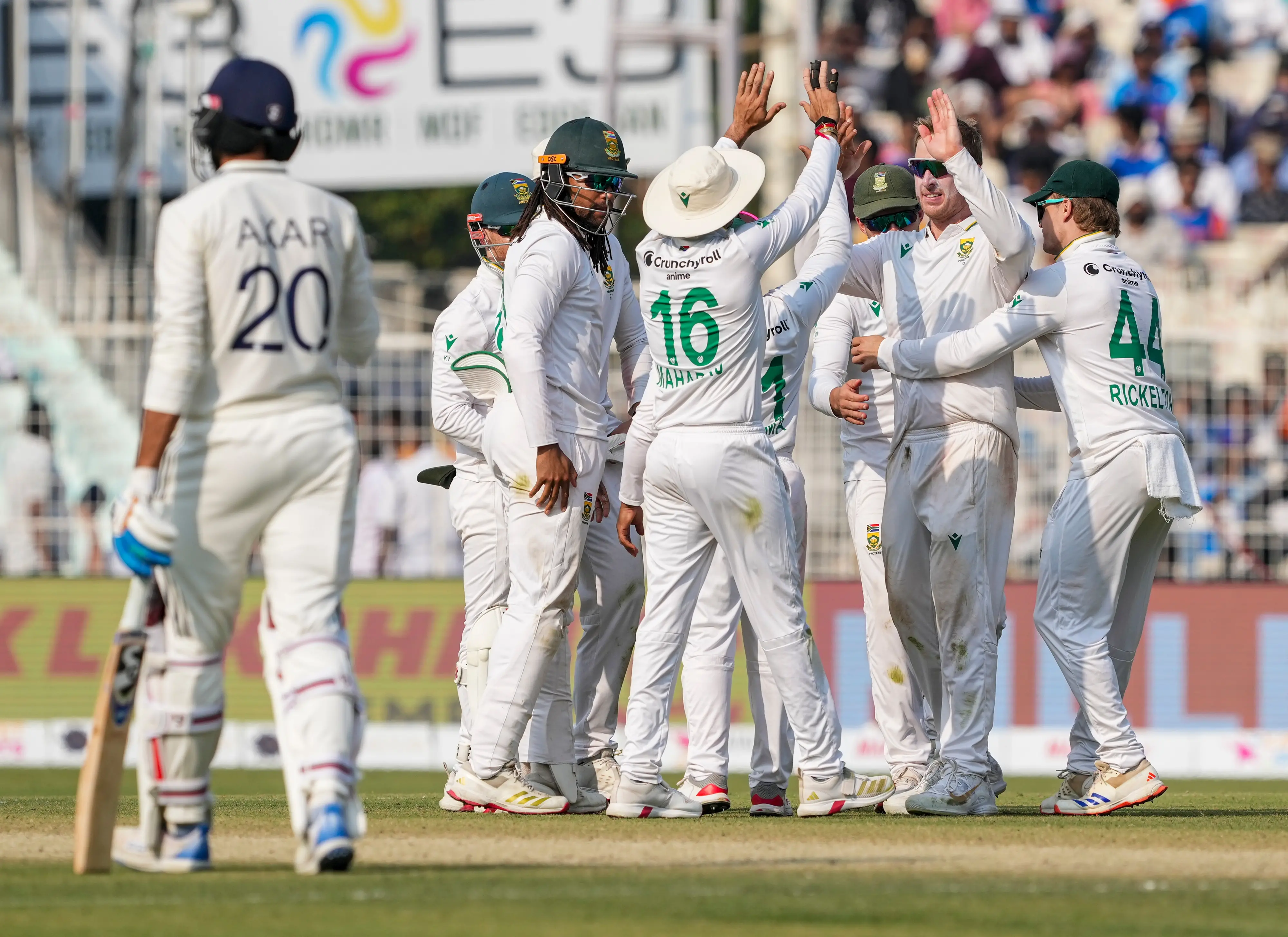 South Africa's Simon Harmer with teammates celebrates after the wicket of India's Kuldeep Yadav during the third day of the first Test cricket match of a series between India and South Africa, at Eden Gardens | PTI