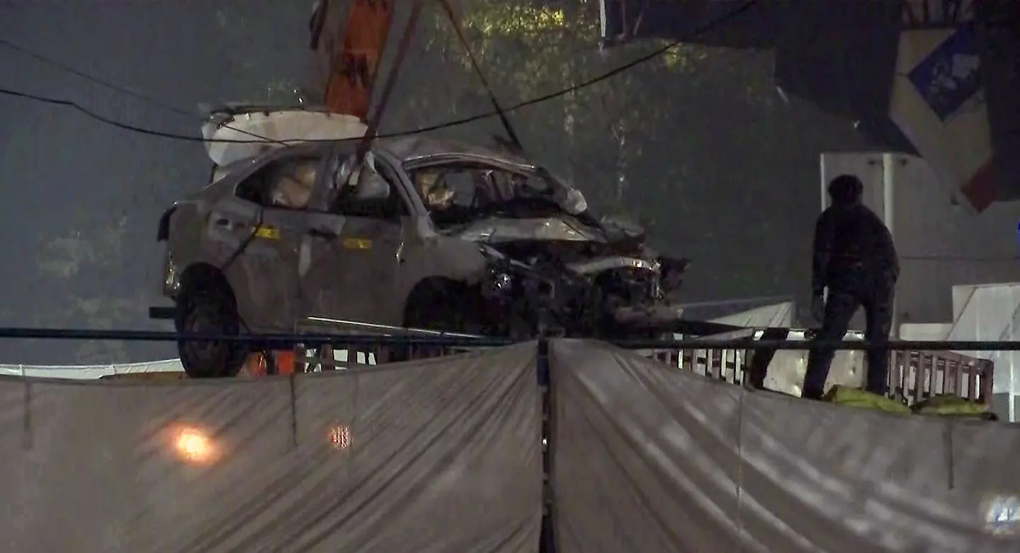 Crane deployed to clear the wreckage at the site of the car blast near Red Fort metro station, in New Delhi on Saturday | File photo: ANI video grab
