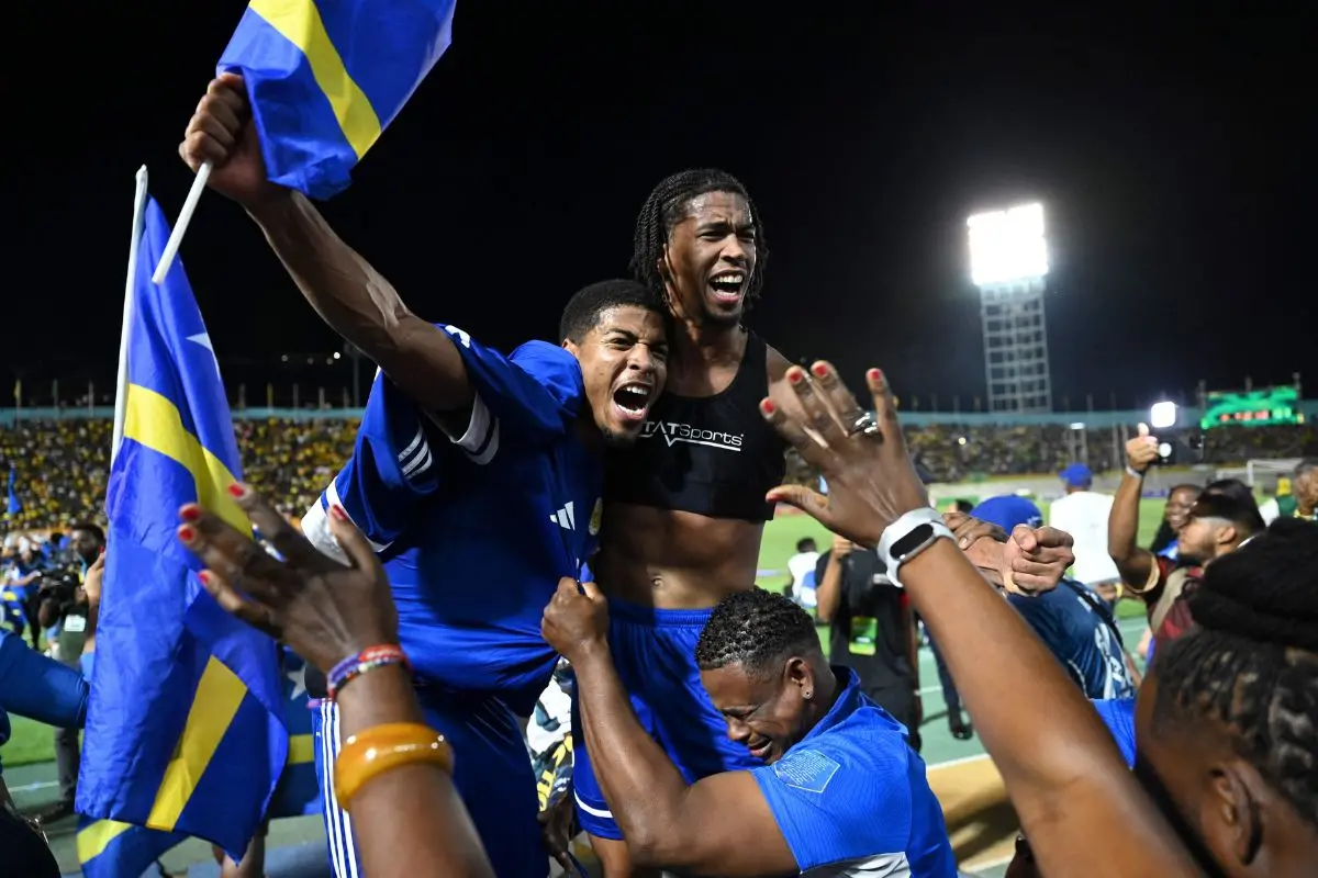 Curaçao players and fans celebrate World Cup 2026 qualification after a 0-0 draw with Jamaica at the National Stadium in Kingston (Photo: AFP)