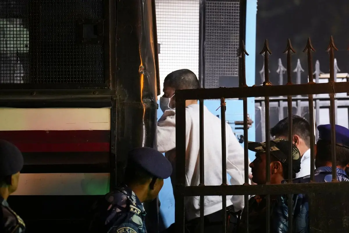 Gangster Anmol Bishnoi being taken after he was produced in the Patiala House Court. (PTI Photo/Karma Bhutia)
