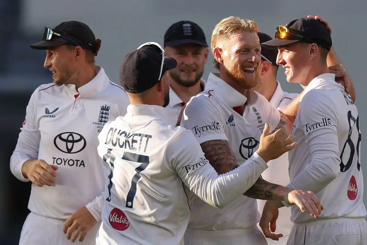 England's players celebrate the wicket of Australia's Scott Boland on day 1 of the first Ashes cricket Test match. (Photo by COLIN MURTY / AFP)