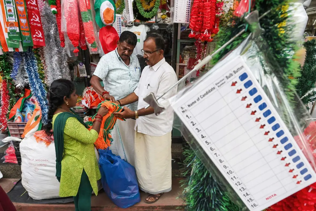 Shoppers browse through election merchandise at a busy stall as campaigning intensifies ahead of the Kerala local body elections at Chala Market, in Thiruvananthapuram on Wednesday. (ANI Photo)