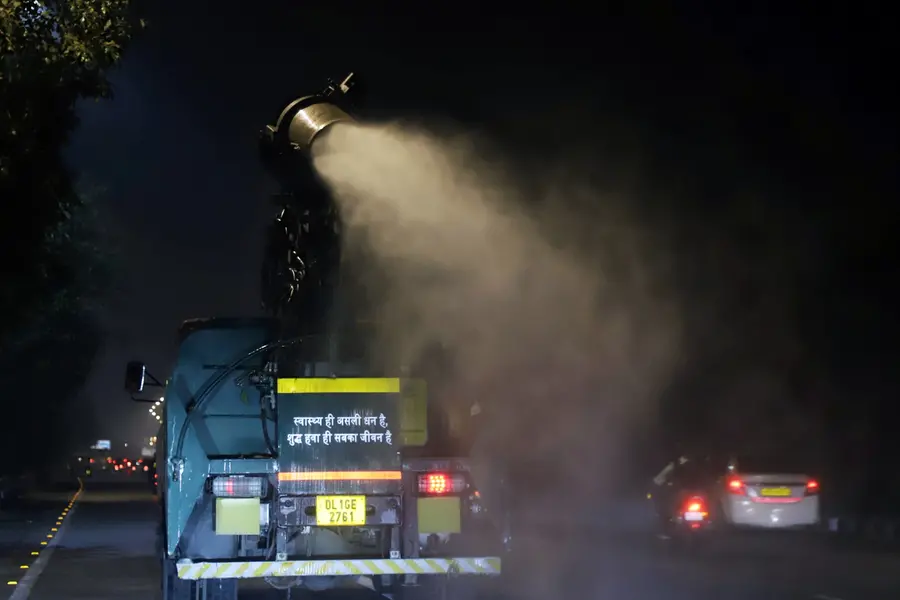 An anti-smog gun sprays water to curb the air pollution