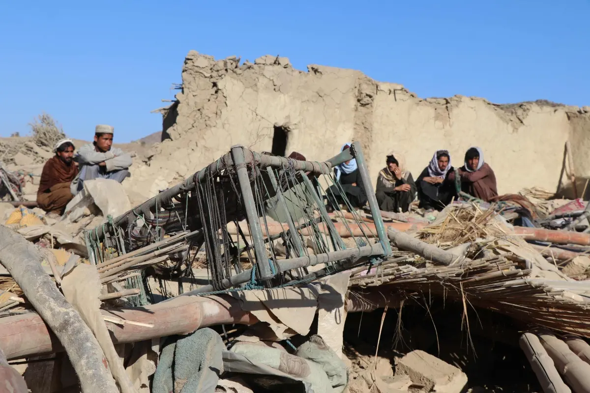 Residents sit at a damaged house after an air strike by Pakistan, in Jige Mughalgai in Khost province | Photo: AFP