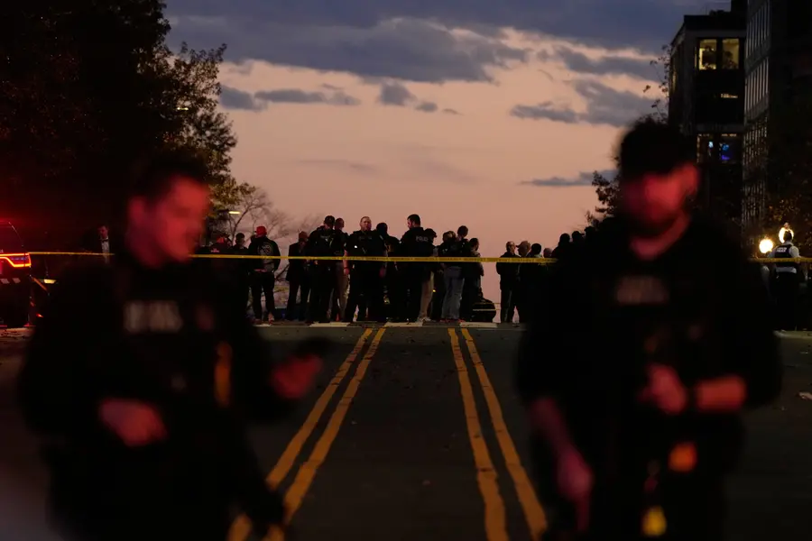 Emergency personnel keep a presence following the shooting of two National Guard soldiers near the White House | AP
