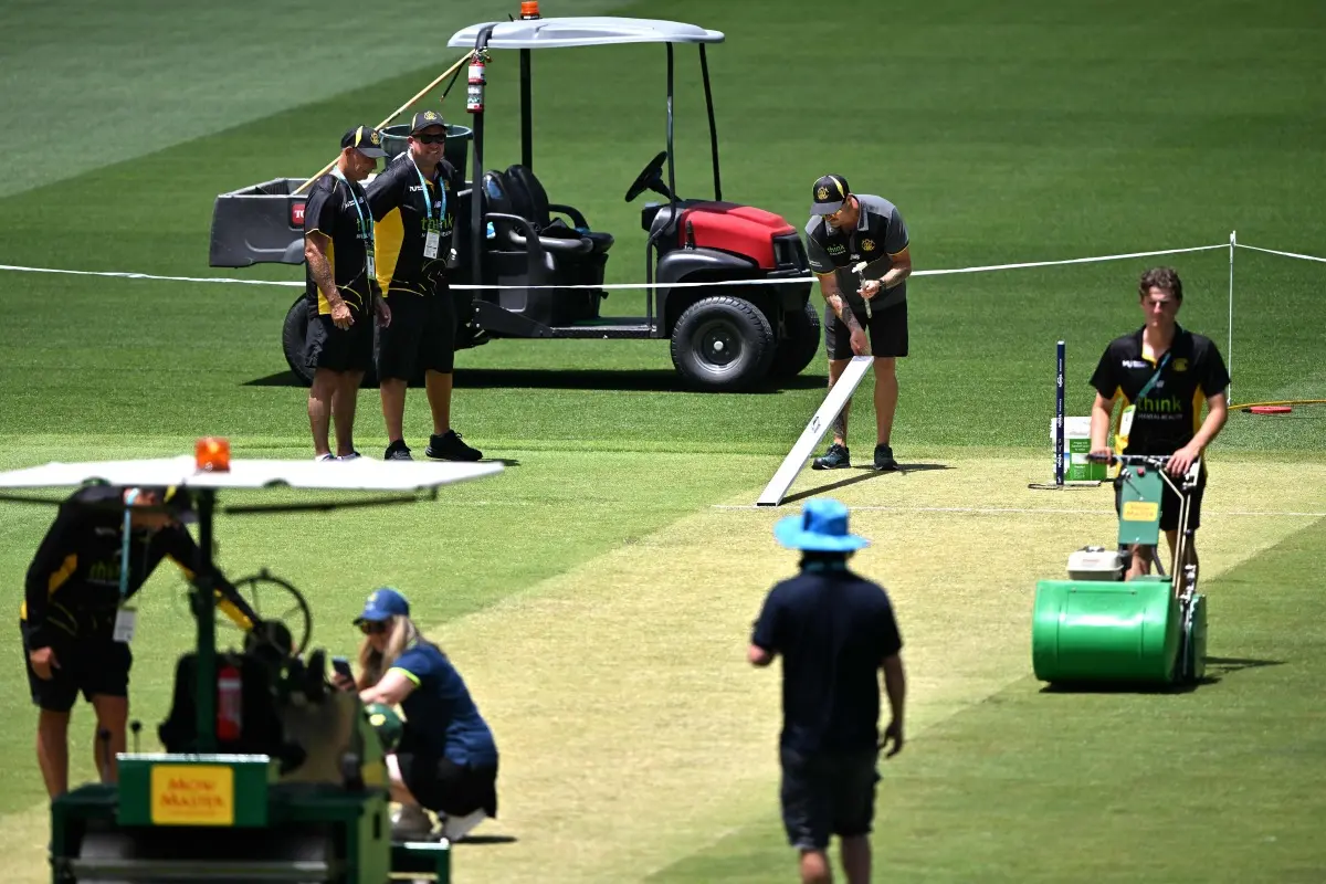 Ground staff gives last touches to the pitch area at Perth Stadium ahead of Ashes opener. | Photo: AFP
