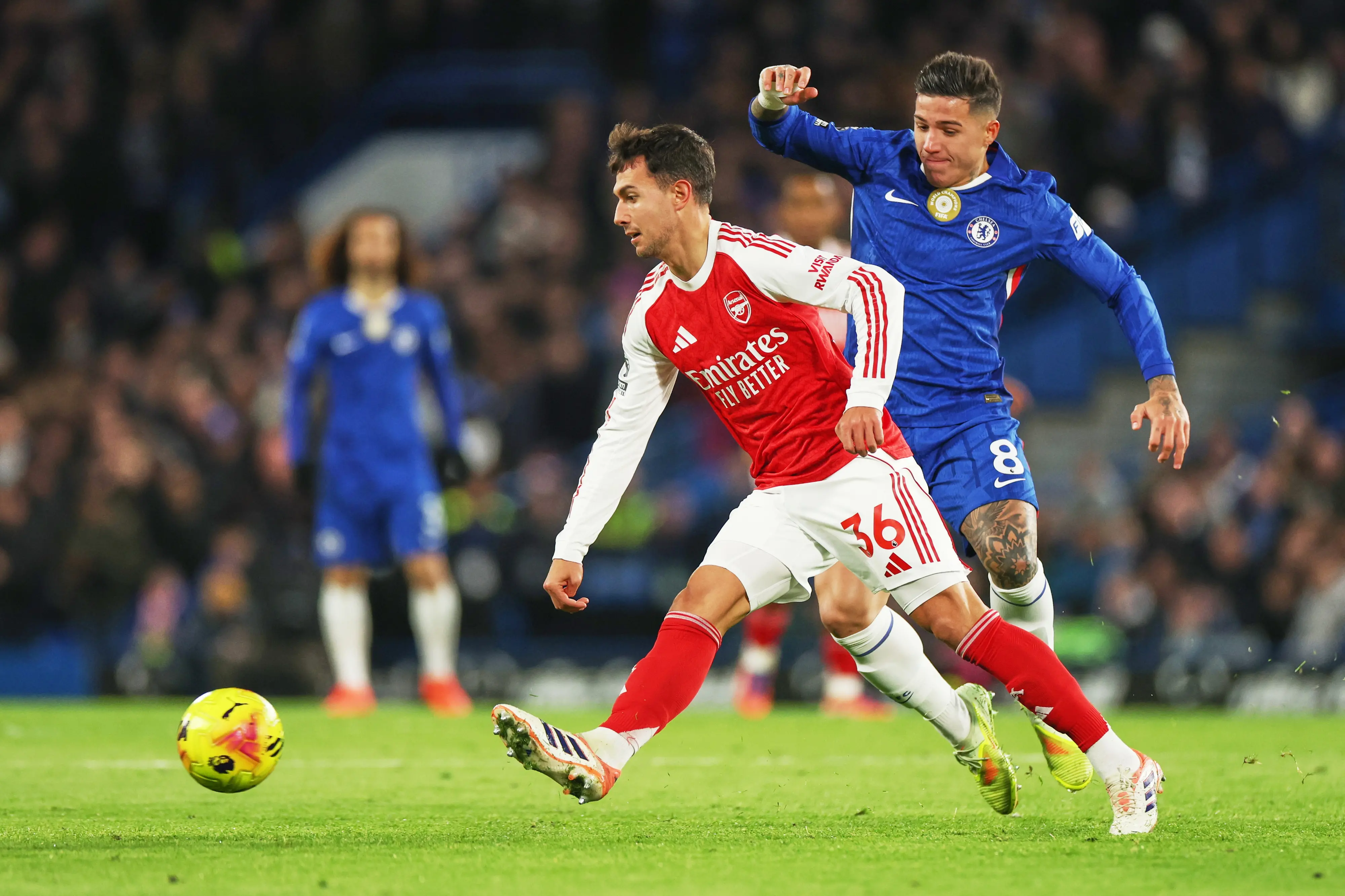 Chelsea's Enzo Fernandez, right, challenges for the ball with Arsenal's Martin Zubimendi during the match | AP