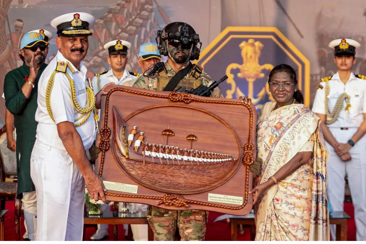 President Droupadi Murmu with Navy chief Admiral Dinesh K Tripathi during an event organised as part of the Navy Day celebrations, in Thiruvananthapuram, Kerala | Photo: PTI
