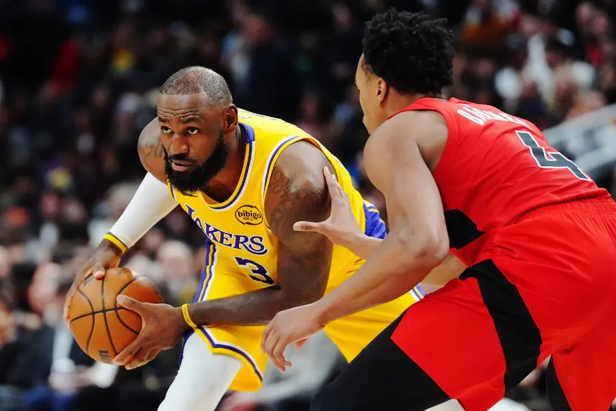 LeBron JamesLos Angeles Lakers' LeBron James, left, is guarded by Toronto Raptors' Scottie Barnes (4) during second-half NBA basketball game action in Toronto