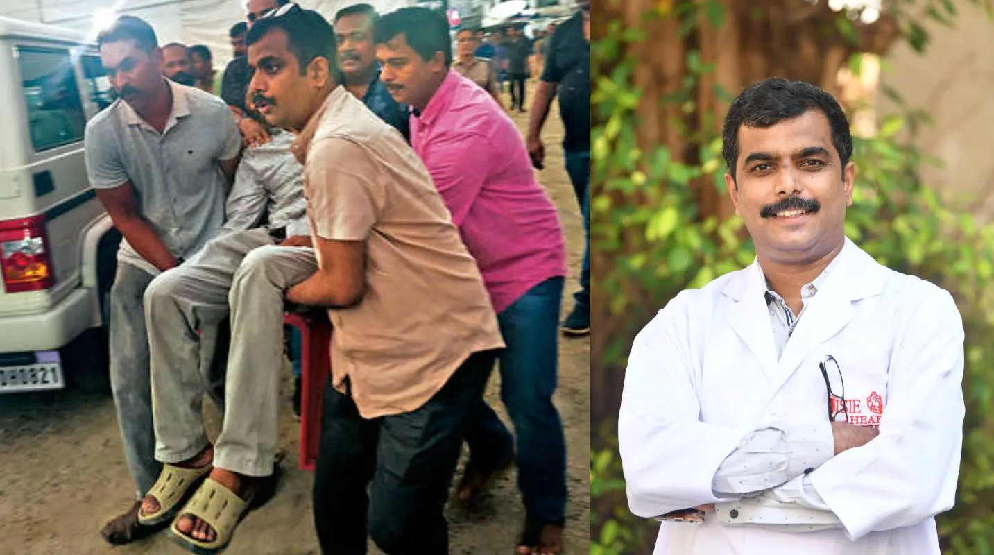 കുഴഞ്ഞുവീണയാളെ ഡോ. ജോ ജോസഫിന്റെ നേതൃത്വത്തിൽ ആംബുലൻസിലേക്ക് കൊണ്ടുപോകുന്നു